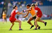 3 August 2025; Omolara Dahunsi of Antrim in action against Eimear Murray, left, and Eilís Hand of Louth during the TG4 All-Ireland Ladies Football Junior Championship final match between Antrim and Louth at Croke Park in Dublin. Photo by Piaras Ó Mídheach/Sportsfile