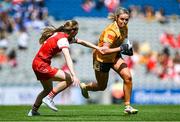 3 August 2025; Aoife Kelly of Antrim in action against Seoda Matthews of Louth during the TG4 All-Ireland Ladies Football Junior Championship final match between Antrim and Louth at Croke Park in Dublin. Photo by Shauna Clinton/Sportsfile