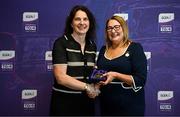 3 August 2025; Uachtarán Cumann Peil Gael na mBan, Trina Murray, makes a presentation to Olivia Condon of Waterford during a pre-match event at Croke Park to honour the squads who represented Mayo and Waterford in the 1999 and 2000 All-Ireland Ladies Senior Football Championship Finals. Photo by Seb Daly/Sportsfile