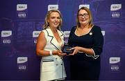 3 August 2025; Uachtarán Cumann Peil Gael na mBan, Trina Murray, makes a presentation to Mary O’Rourke of Waterford during a pre-match event at Croke Park to honour the squads who represented Mayo and Waterford in the 1999 and 2000 All-Ireland Ladies Senior Football Championship Finals. Photo by Seb Daly/Sportsfile