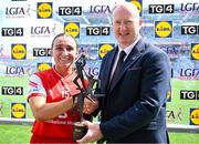 3 August 2025; Ceire Nolan of Louth receives the Player of the Match award from Rónán Ó Coisdealbha, Head of Sport, TG4, following the TG4 All-Ireland Ladies Junior Football Championship Final between Antrim and Louth at Croke Park, Dublin. Photo by Shauna Clinton/Sportsfile