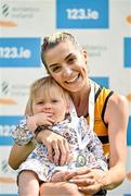 3 August 2025; Senior women's 5000m gold medallists Niamh Allen of Leevale AC, Cork, with her 11 month old daughter Lily during day two of the 153rd 123.ie National Track & Field Senior Championships at Morton Stadium in Dublin. Photo by Sam Barnes/Sportsfile