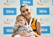 3 August 2025; Senior women's 5000m gold medallists Niamh Allen of Leevale AC, Cork, with her 11 month old daughter Lily during day two of the 153rd 123.ie National Track & Field Senior Championships at Morton Stadium in Dublin. Photo by Sam Barnes/Sportsfile