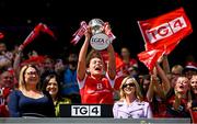 3 August 2025; Louth captain Áine Breen lifts The West County Hotel cup, alongside Uachtarán Cumann Peil Gael na mBan, Trina Murray, left, after her side's victory in the TG4 All-Ireland Ladies Football Junior Championship final match between Antrim and Louth at Croke Park in Dublin. Photo by Shauna Clinton/Sportsfile