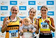 3 August 2025; Senior women's 5000m medallists Niamh Allen of Leevale AC, Cork, centre, gold, with her 11 month old daughter Lily, Anika Thompson of Leevale AC, silver, left, and Fiona Everard of Bandon AC, Cork, bronze, right, during day two of the 153rd 123.ie National Track & Field Senior Championships at Morton Stadium in Dublin. Photo by Sam Barnes/Sportsfile