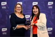 3 August 2025; Uachtarán Cumann Peil Gael na mBan, Trina Murray, makes a presentation to Sinead Gordon of Mayo during a pre-match event at Croke Park to honour the squads who represented Mayo and Waterford in the 1999 and 2000 All-Ireland Ladies Senior Football Championship Finals. Photo by Seb Daly/Sportsfile