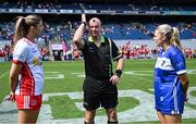 3 August 2025; Referee Shane Curley, centre, is joined by Tyrone captain Aoibhinn McHugh, left, and Laois captain Andrea Moran for the coin toss before the TG4 All-Ireland Ladies Football Intermediate Championship final match between Laois and Tyrone at Croke Park in Dublin. Photo by Shauna Clinton/Sportsfile