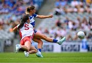 3 August 2025; Shifra Havill of Laois scores her side's first goal, under pressure from Claire Canavan of Tyrone, during the TG4 All-Ireland Ladies Football Intermediate Championship final match between Laois and Tyrone at Croke Park in Dublin. Photo by Piaras Ó Mídheach/Sportsfile