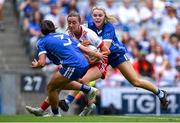 3 August 2025; Aoife Horisk of Tyrone is tackled by Laois players Clodagh Dunne, left, and Andrea Moran during the TG4 All-Ireland Ladies Football Intermediate Championship final match between Laois and Tyrone at Croke Park in Dublin. Photo by Shauna Clinton/Sportsfile