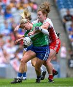 3 August 2025; Laois goalkeeper Eimear Barry is tackled by Niamh O'Neill of Tyrone during the TG4 All-Ireland Ladies Football Intermediate Championship final match between Laois and Tyrone at Croke Park in Dublin. Photo by Shauna Clinton/Sportsfile