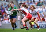 3 August 2025; Laois goalkeeper Eimear Barry is tackled by Niamh O'Neill of Tyrone during the TG4 All-Ireland Ladies Football Intermediate Championship final match between Laois and Tyrone at Croke Park in Dublin. Photo by Shauna Clinton/Sportsfile