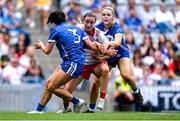 3 August 2025; Aoife Horisk of Tyrone is tackled by Laois players Clodagh Dunne, left, and Andrea Moran during the TG4 All-Ireland Ladies Football Intermediate Championship final match between Laois and Tyrone at Croke Park in Dublin. Photo by Shauna Clinton/Sportsfile