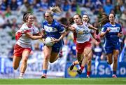3 August 2025; Emma Lawlor of Laois is tackled by Tyrone players Méabh Corrigan, left, and Gráinne McKenna during the TG4 All-Ireland Ladies Football Intermediate Championship final match between Laois and Tyrone at Croke Park in Dublin. Photo by Shauna Clinton/Sportsfile