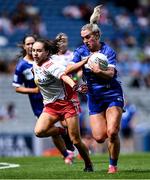 3 August 2025; Emma Lawlor of Laois in action against Gráinne McKenna of Tyrone during the TG4 All-Ireland Ladies Football Intermediate Championship final match between Laois and Tyrone at Croke Park in Dublin. Photo by Shauna Clinton/Sportsfile