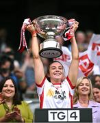 3 August 2025; Tyrone captain Aoibhinn McHugh lifts the Mary Quinn Memorial cup after the TG4 All-Ireland Ladies Football Intermediate Championship final match between Laois and Tyrone at Croke Park in Dublin. Photo by Piaras Ó Mídheach/Sportsfile