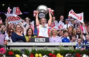 3 August 2025; Tyrone captain Aoibhinn McHugh lifts the Mary Quinn Memorial cup, alongside Uachtarán Cumann Peil Gael na mBan, Trina Murray, left, after the TG4 All-Ireland Ladies Football Intermediate Championship final match between Laois and Tyrone at Croke Park in Dublin. Photo by Shauna Clinton/Sportsfile