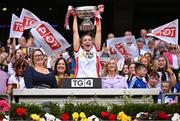 3 August 2025; Tyrone captain Aoibhinn McHugh lifts the Mary Quinn Memorial cup, alongside Uachtarán Cumann Peil Gael na mBan, Trina Murray, left, after the TG4 All-Ireland Ladies Football Intermediate Championship final match between Laois and Tyrone at Croke Park in Dublin. Photo by Shauna Clinton/Sportsfile