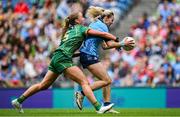3 August 2025; Nicole Owens of Dublin on her way to scoring her side's first goal despite the efforts of Aoibhín Cleary of Meath during the TG4 All-Ireland Ladies Football Senior Championship final match between Dublin and Meath at Croke Park in Dublin. Photo by Shauna Clinton/Sportsfile
