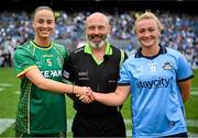 3 August 2025; Referee Gus Chapman, centre, is joined by Meath captain Aoibhín Cleary, left, and Dublin captain Carla Rowe for the coin toss before the TG4 All-Ireland Ladies Football Senior Championship final match between Dublin and Meath at Croke Park in Dublin. Photo by Shauna Clinton/Sportsfile