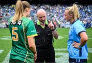 3 August 2025; Referee Gus Chapman, centre, is joined by Meath captain Aoibhín Cleary, left, and Dublin captain Carla Rowe for the coin toss before the TG4 All-Ireland Ladies Football Senior Championship final match between Dublin and Meath at Croke Park in Dublin. Photo by Shauna Clinton/Sportsfile