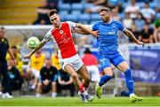 3 August 2025; Mason Melia of St Patrick's Athletic in action against Andy Boyle of Waterford during the SSE Airtricity Men's Premier Division match between Waterford and St Patrick's Athletic at Regional Sports Centre in Waterford. Photo by Tyler Miller/Sportsfile