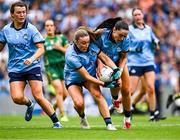 3 August 2025; Dublin players Niamh Donlon, left, and Sinéad Goldrick combine to gather possession during the TG4 All-Ireland Ladies Football Senior Championship final match between Dublin and Meath at Croke Park in Dublin. Photo by Piaras Ó Mídheach/Sportsfile