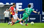 3 August 2025; Mason Melia of St Patrick's Athletic shoots on goal despite pressure from Waterford goalkeeper Stephen McMullan during the SSE Airtricity Men's Premier Division match between Waterford and St Patrick's Athletic at Regional Sports Centre in Waterford. Photo by Tyler Miller/Sportsfile