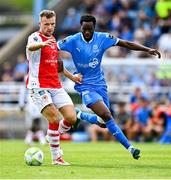 3 August 2025; Jamie Lennon of St Patrick's Athletic in action against James Olayinka of Waterford during the SSE Airtricity Men's Premier Division match between Waterford and St Patrick's Athletic at Regional Sports Centre in Waterford. Photo by Tyler Miller/Sportsfile