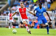 3 August 2025; Jamie Lennon of St Patrick's Athletic in action against James Olayinka of Waterford during the SSE Airtricity Men's Premier Division match between Waterford and St Patrick's Athletic at Regional Sports Centre in Waterford. Photo by Tyler Miller/Sportsfile