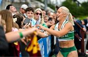 3 August 2025; Sarah Lavin of Emerald AC, Limerick, signs autographs after winning the senior women's 100m hurdles final during day two of the 153rd 123.ie National Track & Field Senior Championships at Morton Stadium in Dublin. Photo by Sam Barnes/Sportsfile