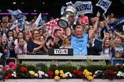 3 August 2025; Dublin captain Carla Rowe lifts the Brendan Martin cup, alongside Uachtarán Cumann Peil Gael na mBan, Trina Murray, left, after the TG4 All-Ireland Ladies Football Senior Championship final match between Dublin and Meath at Croke Park in Dublin. Photo by Shauna Clinton/Sportsfile