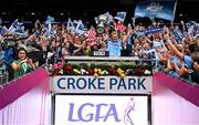 3 August 2025; Dublin captain Carla Rowe lifts the Brendan Martin cup, alongside Uachtarán Cumann Peil Gael na mBan, Trina Murray, left, after the TG4 All-Ireland Ladies Football Senior Championship final match between Dublin and Meath at Croke Park in Dublin. Photo by Shauna Clinton/Sportsfile