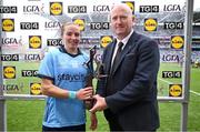 3 August 2025; Orlagh Nolan of Dublin receives the Player of the Match award from Rónán Ó Coisdealbha, Head of Sport, TG4, after the TG4 All-Ireland Ladies Football Senior Championship final match between Dublin and Meath at Croke Park in Dublin. Photo by Shauna Clinton/Sportsfile