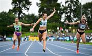3 August 2025; Ciara Neville of Emerald AC, Limerick, centre, crosses the line to win the senior women's 100m final, ahead of Sarah Leahy of Killarney Valley AC, Kerry, left, and Lauren Roy of Fast Twitch AC, right,  during day two of the 153rd 123.ie National Track & Field Senior Championships at Morton Stadium in Dublin. Photo by Sam Barnes/Sportsfile