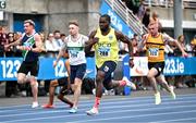 3 August 2025; Bori Akinola of UCD AC, Dublin, centre, on his way to winning the senior men's 100m final during day two of the 153rd 123.ie National Track & Field Senior Championships at Morton Stadium in Dublin. Photo by Sam Barnes/Sportsfile