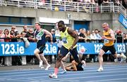 3 August 2025; Bori Akinola of UCD AC, Dublin, centre, on his way to winning the senior men's 100m final during day two of the 153rd 123.ie National Track & Field Senior Championships at Morton Stadium in Dublin. Photo by Sam Barnes/Sportsfile