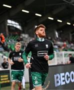 3 August 2025; Connor Malley of Shamrock Rovers runs out to warms up wearing the jersey of Templeogue United’s over 35’s in support of the O’Neill family before the SSE Airtricity Men's Premier Division match between Shamrock Rovers and Derry City at Tallaght Stadium in Dublin.  Photo by Stephen McCarthy/Sportsfile