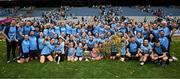 3 August 2025; Dublin players, coaches and supporters celebrate with the Brendan Martin cup after their side's victory in the TG4 All-Ireland Ladies Football Senior Championship final match between Dublin and Meath at Croke Park in Dublin. Photo by Seb Daly/Sportsfile