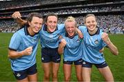 3 August 2025; Dublin players, from left, Leah Caffrey, Hannah Tyrrell, Carla Rowe and Nicole Owens celebrate after their side's victory in the TG4 All-Ireland Ladies Football Senior Championship final match between Dublin and Meath at Croke Park in Dublin. Photo by Seb Daly/Sportsfile
