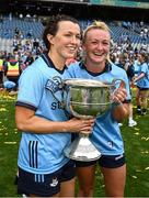 3 August 2025; Dublin players Leah Caffrey, left, and Carla Rowe celebrate with the Brendan Martin cup after their side's victory in the TG4 All-Ireland Ladies Football Senior Championship final match between Dublin and Meath at Croke Park in Dublin. Photo by Seb Daly/Sportsfile