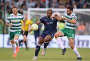 3 August 2025; Dipo Akinyemi of Derry City in action against Roberto Lopes of Shamrock Rovers during the SSE Airtricity Men's Premier Division match between Shamrock Rovers and Derry City at Tallaght Stadium in Dublin.  Photo by Stephen McCarthy/Sportsfile