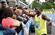 3 August 2025; Bori Akinola of UCD AC, Dublin, right, celebrates with friends and family after winning the senior men's 100m final during day two of the 153rd 123.ie National Track & Field Senior Championships at Morton Stadium in Dublin. Photo by Sam Barnes/Sportsfile