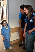 4 August 2025; TG4 All-Ireland Ladies Senior Football Champions, Dublin footballers Rachel Hartnett and Hannah Leahy pictured with Nikki Hayes, aged 16, from Limerick, during a visit by the players to Children's Health Ireland at Crumlin, Dublin. Photo by Sam Barnes/Sportsfile