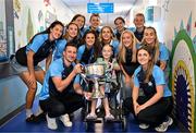 4 August 2025; TG4 All-Ireland Ladies Senior Football Champions Dublin pictured with the Brendan Martin Cup and Zoe Moore, aged 9, from Ballinteer Dublin, neice of Joint manager Derek Murray, during a visit by the players to Children's Health Ireland at Crumlin, Dublin. Photo by Sam Barnes/Sportsfile