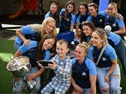 4 August 2025; TG4 All-Ireland Ladies Senior Football Champions Dublin pictured with the Brendan Martin Cup and Shane Comford, aged 7, from Lucan, Dublin, during a visit by the players to Children's Health Ireland at Crumlin, Dublin. Photo by Sam Barnes/Sportsfile