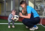 4 August 2025; TG4 All-Ireland Ladies Senior Football Champions Dublin footballer Aoife Curran pictured with Aoife Smith, aged 17 months, from Cavan, during a visit by the players to Children's Health Ireland at Crumlin, Dublin. Photo by Sam Barnes/Sportsfile