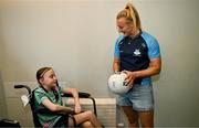 4 August 2025; TG4 All-Ireland Ladies Senior Football Champions Dublin footballer Carla Rowe pictured with  Zoe Moore, aged 9, from Ballinteer Dublin, neice of Joint manager Derek Murray, during a visit by the players to Children's Health Ireland at Crumlin, Dublin. Photo by Sam Barnes/Sportsfile
