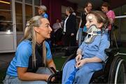 4 August 2025; TG4 All-Ireland Ladies Senior Football Champions Dublin footballer Aoife Curran pictured with Nikki Hayes, aged 16, from Limerick, during a visit by the players to Children's Health Ireland at Crumlin, Dublin. Photo by Sam Barnes/Sportsfile