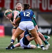 2 August 2025; Sam Monaghan of Ireland is tackled by Lisa Thomson of Scotland during the Women's Rugby World Cup warm-up match between Ireland and Scotland at Virgin Media Park in Cork. Photo by Shauna Clinton/Sportsfile