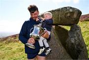 4 August 2025; Senior Hurling winner Colin Ryan of Limerick with his son Fionn and the trophy after the M. Donnelly GAA Poc Fada All-Ireland Finals at Annaverna Mountain in the Cooley Peninsula, Ravensdale, Louth. Photo by Piaras Ó Mídheach/Sportsfile